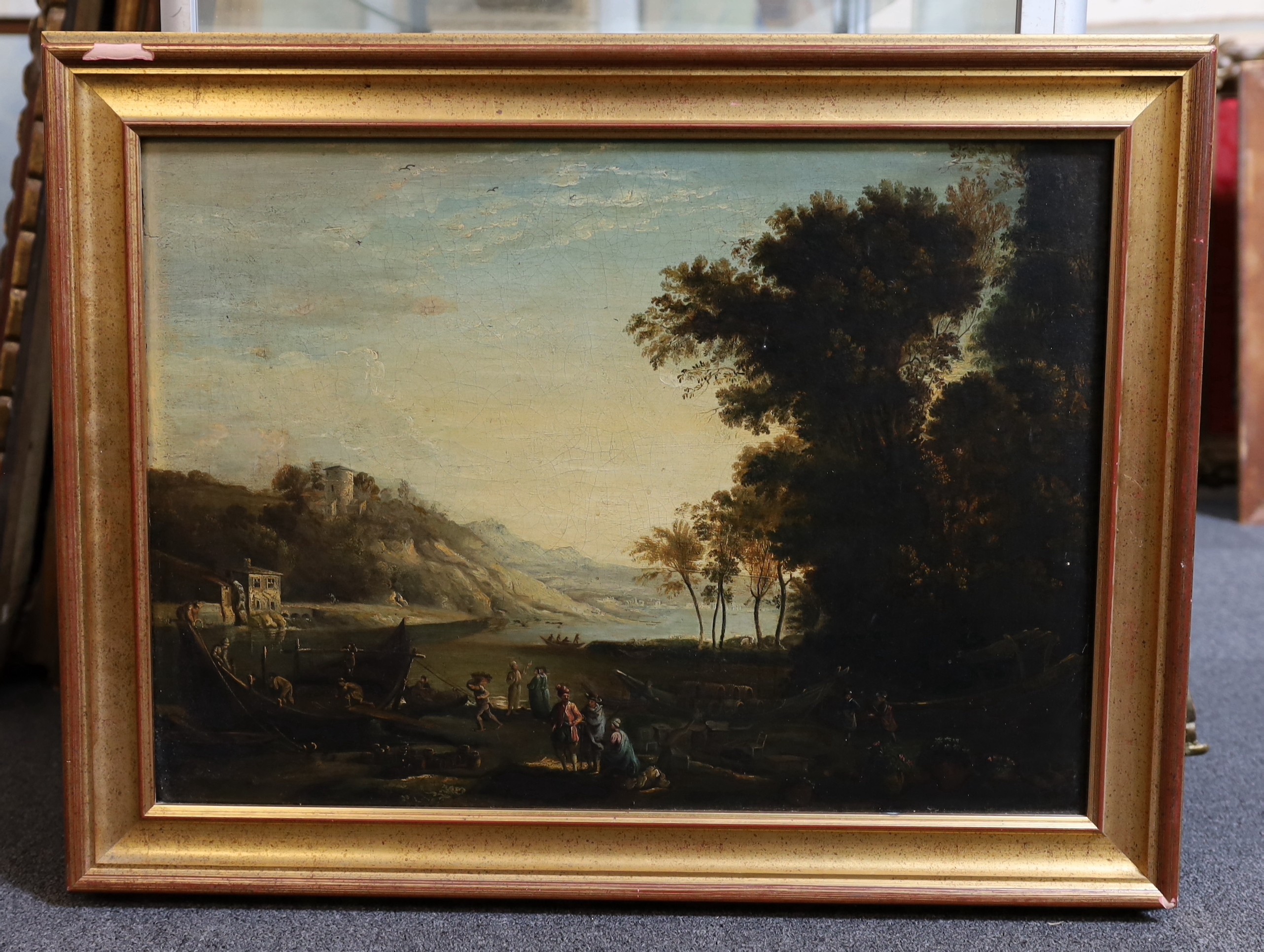 Late 18th century English School, Italianate landscape with figures loading barrels into a boat, oil on canvas, 43 x 61cm